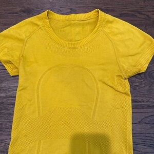 Mustard yellow Lululemon swift T. size 2. the longer length shirt